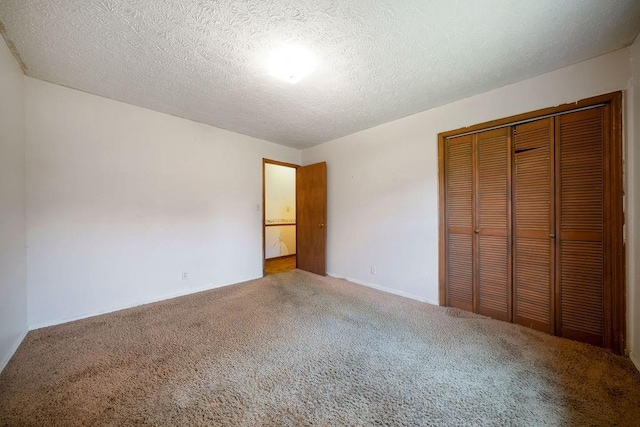 101 Beaver Run, Lagrange, GA 30241 - unfurnished bedroom with carpet, a closet, and a textured ceiling