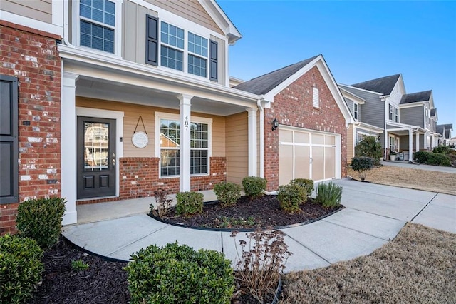 exterior space with a garage and covered porch