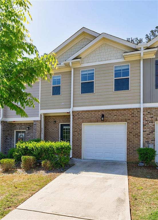 8475 Douglass Trl, Jonesboro, GA 30236 - multi unit property featuring an attached garage, concrete driveway, and brick siding