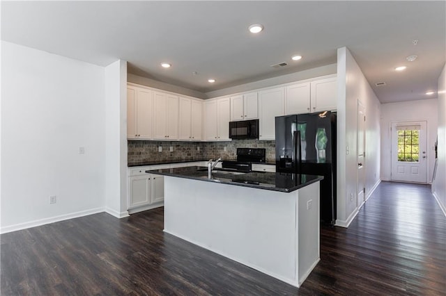 8475 Douglass Trl, Jonesboro, GA 30236 - kitchen with tasteful backsplash, visible vents, black appliances, and dark wood finished floors