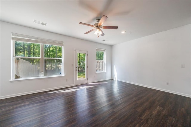 8475 Douglass Trl, Jonesboro, GA 30236 - empty room featuring baseboards, recessed lighting, dark wood-style floors, a ceiling fan, and visible vents