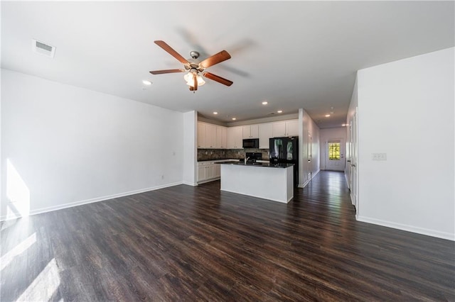 8475 Douglass Trl, Jonesboro, GA 30236 - kitchen featuring open floor plan, black microwave, refrigerator, and dark wood-style floors