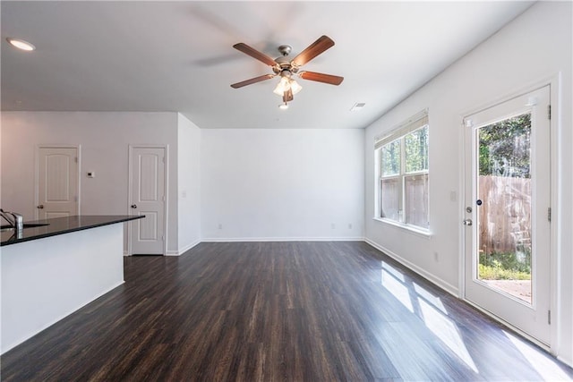 8475 Douglass Trl, Jonesboro, GA 30236 - unfurnished living room featuring baseboards, recessed lighting, dark wood-style floors, a ceiling fan, and visible vents