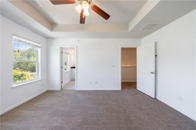 8475 Douglass Trl, Jonesboro, GA 30236 - unfurnished bedroom with visible vents, baseboards, a raised ceiling, and carpet floors