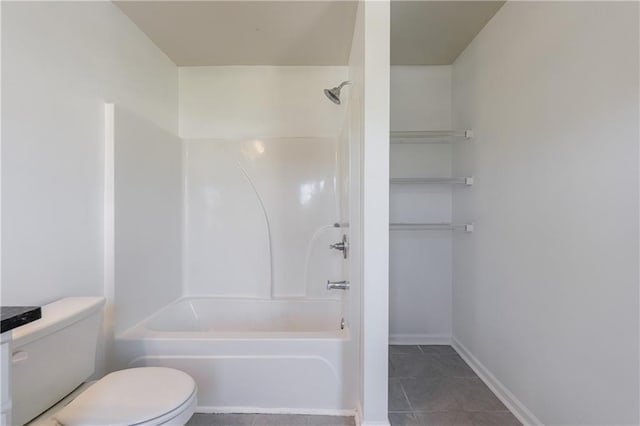 8475 Douglass Trl, Jonesboro, GA 30236 - bathroom with toilet, shower / tub combination, tile patterned flooring, and baseboards