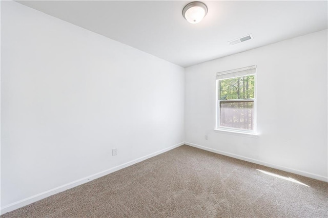 8475 Douglass Trl, Jonesboro, GA 30236 - empty room featuring carpet flooring, visible vents, and baseboards