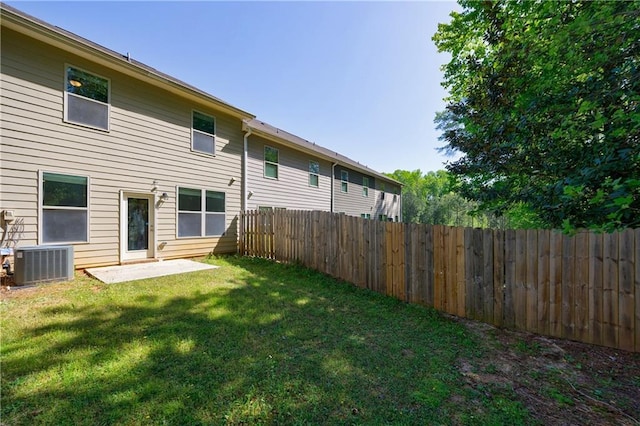 8475 Douglass Trl, Jonesboro, GA 30236 - rear view of house with cooling unit, a yard, and fence