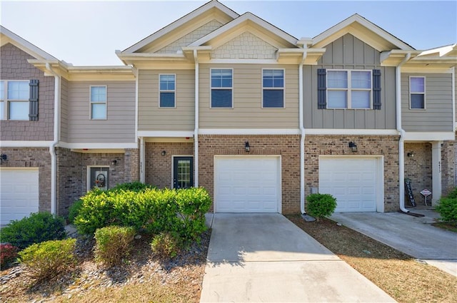 8475 Douglass Trl, Jonesboro, GA 30236 - townhome / multi-family property featuring board and batten siding, a garage, and driveway