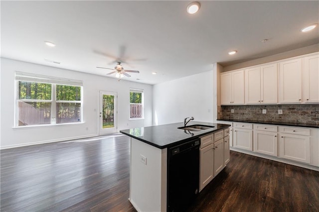 8475 Douglass Trl, Jonesboro, GA 30236 - kitchen featuring dishwasher, ceiling fan, a sink, and dark countertops