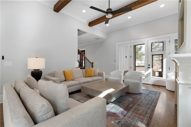living room with wood finished floors, beam ceiling, recessed lighting, ceiling fan, and stairs