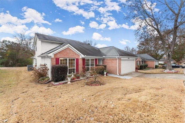 view of front of property with a front yard and a garage