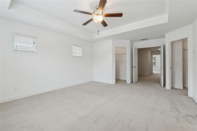 6761 Cedar Glen Rd, Peachtree Corners, GA 30360 - unfurnished bedroom featuring a tray ceiling, light colored carpet, and ceiling fan