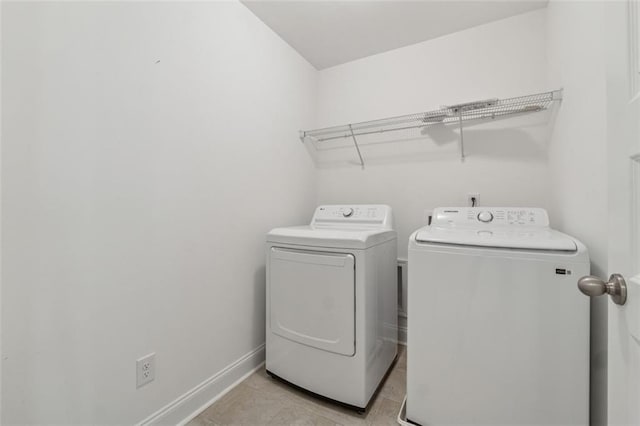 6761 Cedar Glen Rd, Peachtree Corners, GA 30360 - laundry room with washer and clothes dryer and light tile patterned floors