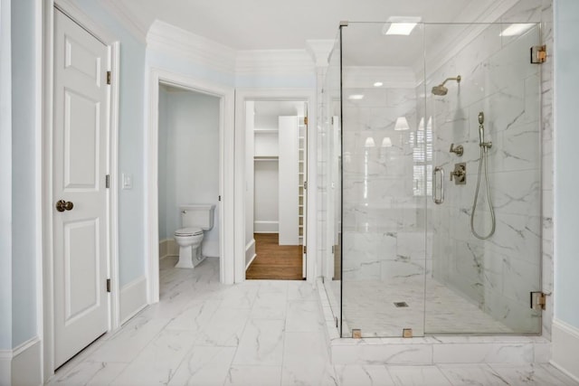 bathroom featuring an enclosed shower, ornamental molding, and toilet