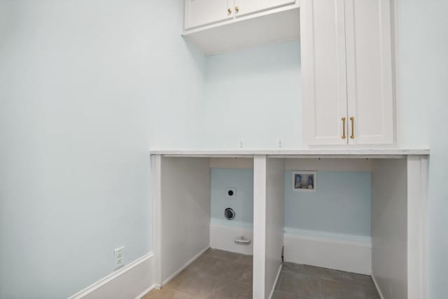 clothes washing area with cabinets, tile patterned flooring, hookup for an electric dryer, and washer hookup