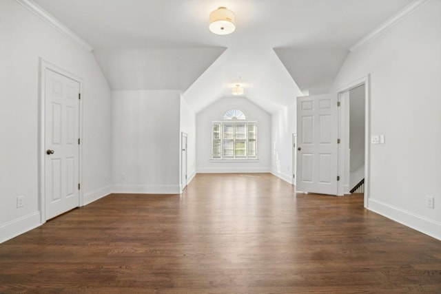 additional living space with lofted ceiling and dark wood-type flooring