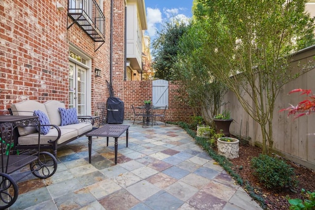 view of patio / terrace featuring an outdoor hangout area and grilling area