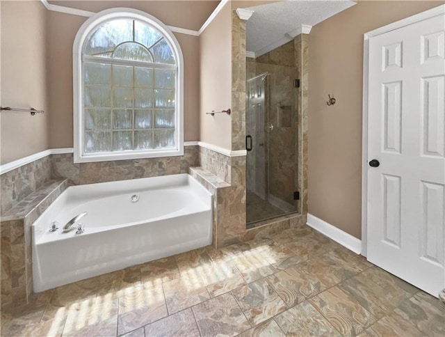 bathroom featuring shower with separate bathtub and crown molding