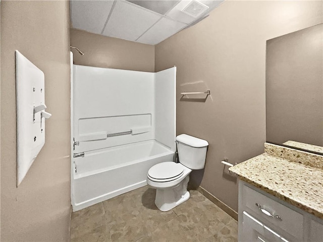 full bathroom featuring vanity, bathtub / shower combination, toilet, and a paneled ceiling