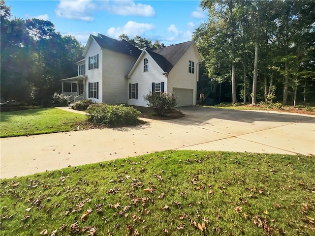 view of property exterior featuring a lawn and a garage