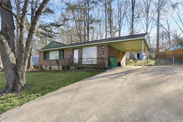 single story home with a front yard and a carport