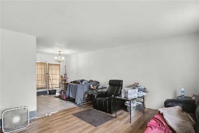 interior space with a notable chandelier and light wood-type flooring