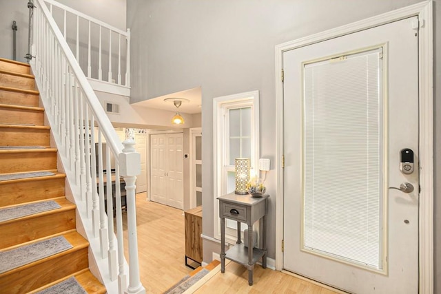 114 Emily Ln, Alpharetta, GA 30009 - foyer entrance with light wood-type flooring and stairs