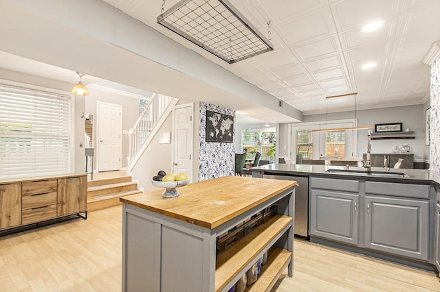 114 Emily Ln, Alpharetta, GA 30009 - kitchen featuring gray cabinetry, dishwasher, butcher block counters, light wood-style flooring, and a sink
