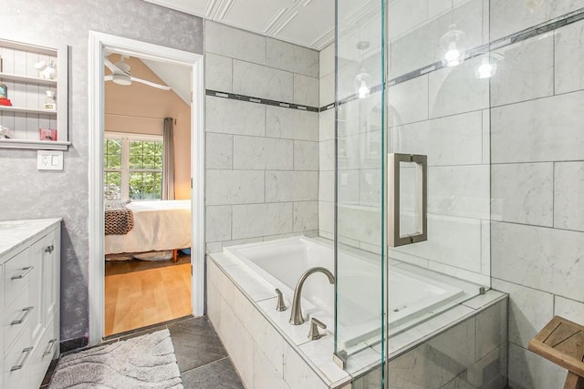 114 Emily Ln, Alpharetta, GA 30009 - ensuite bathroom featuring vanity, a relaxing tiled tub, and tiled shower