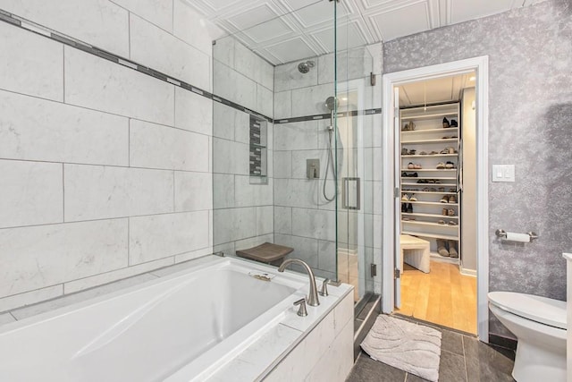 114 Emily Ln, Alpharetta, GA 30009 - bathroom featuring a stall shower, a spacious closet, a garden tub, toilet, and an ornate ceiling