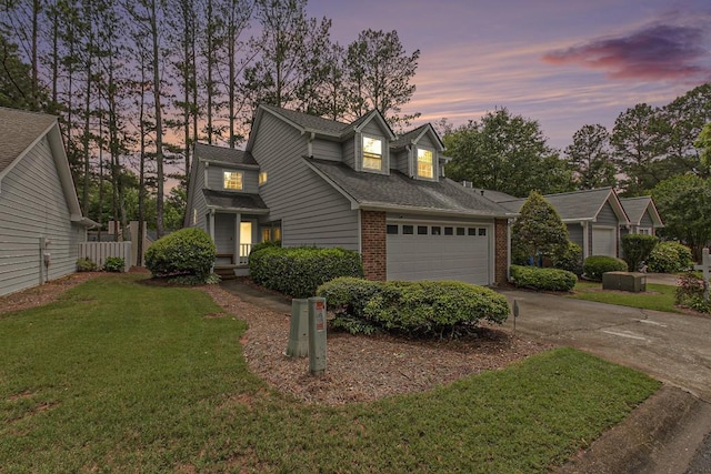 114 Emily Ln, Alpharetta, GA 30009 - traditional-style house featuring brick siding, concrete driveway, a shingled roof, and an attached garage