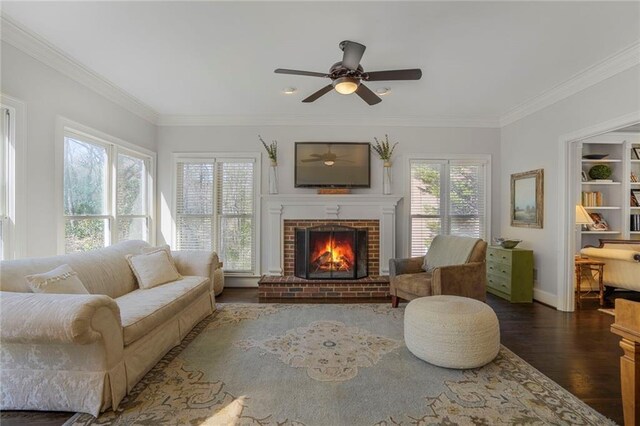 interior space with a brick fireplace and a ceiling fan