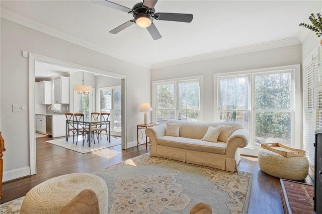 sunroom with a sink and ceiling fan