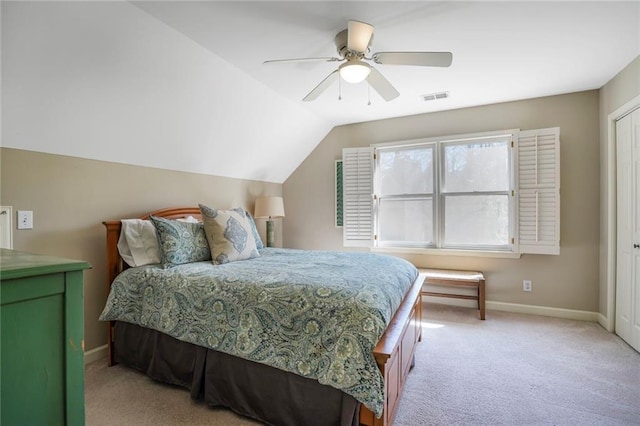 bedroom featuring light carpet, baseboards, visible vents, lofted ceiling, and ceiling fan