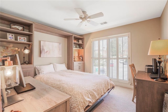 bedroom featuring light carpet, visible vents, and a ceiling fan