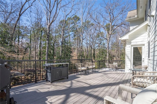 deck featuring outdoor dining area