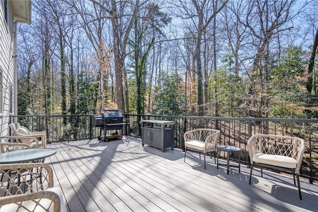 wooden deck featuring grilling area