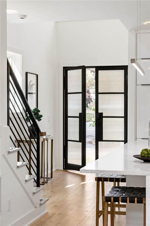 foyer with light hardwood / wood-style floors