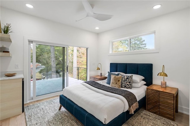 bedroom with ceiling fan, light hardwood / wood-style flooring, access to exterior, and multiple windows