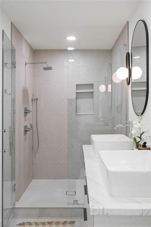 bathroom with an enclosed shower and vanity