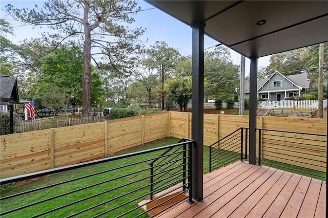 wooden terrace with a yard