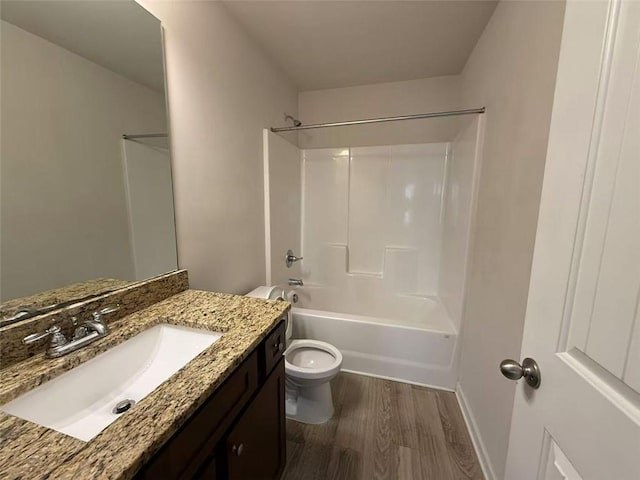 6474 Grey Fox Way, Riverdale, GA 30296 - full bathroom with toilet, wood finished floors, vanity, shower / washtub combination, and baseboards