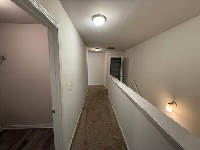6474 Grey Fox Way, Riverdale, GA 30296 - hall featuring an upstairs landing, baseboards, and dark carpet