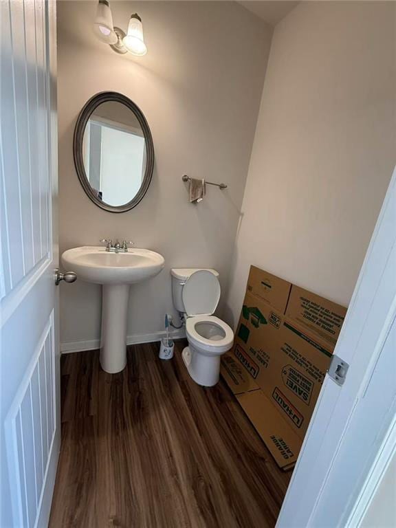6474 Grey Fox Way, Riverdale, GA 30296 - bathroom featuring wood finished floors, toilet, and baseboards
