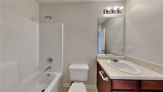 full bathroom featuring baseboards, toilet, bathtub / shower combination, and vanity