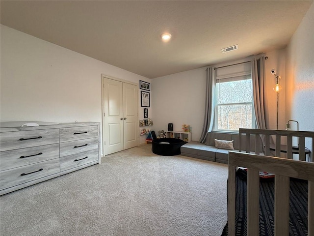 bedroom featuring visible vents and carpet flooring