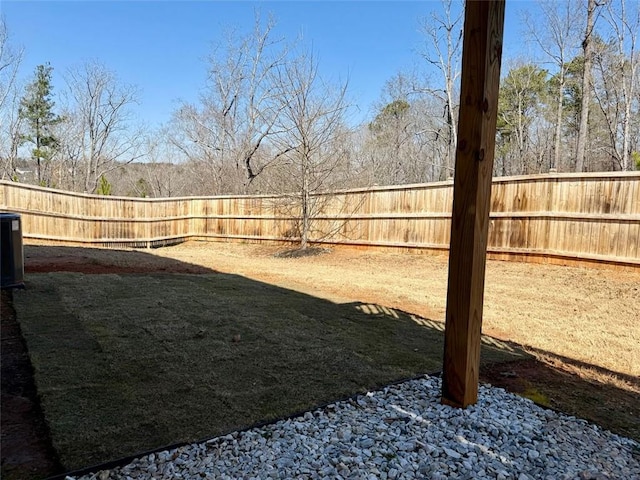 view of yard with a fenced backyard