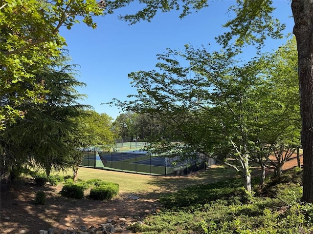 view of sport court with fence