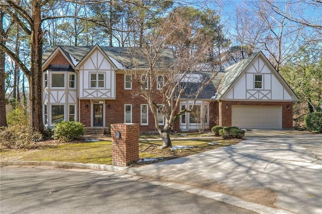 english style home with a front yard