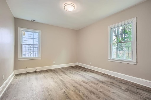 1002 Ira St SW, Atlanta, GA 30310 - unfurnished room with visible vents, baseboards, and wood finished floors